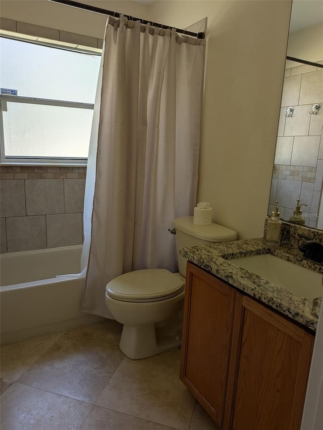 full bathroom with vanity, shower / tub combo, tile patterned floors, and toilet