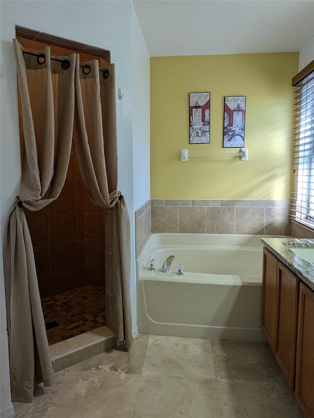 bathroom featuring independent shower and bath and vanity