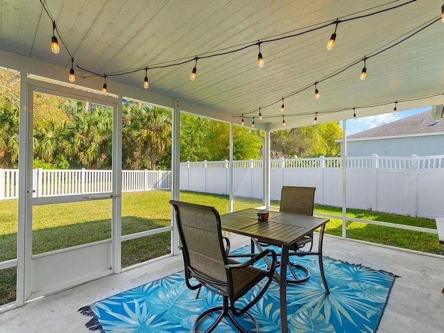 sunroom / solarium with track lighting