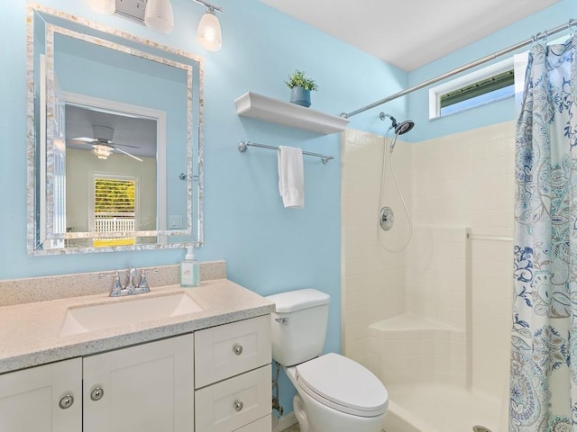 bathroom featuring vanity, toilet, and a shower with shower curtain