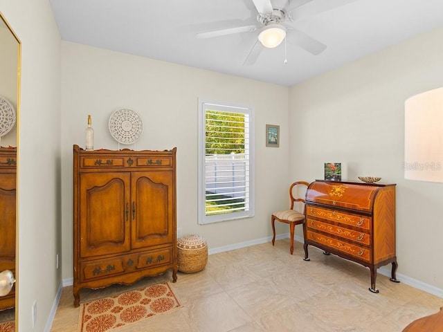 sitting room featuring ceiling fan