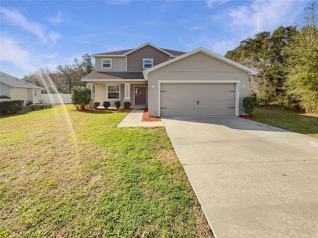 view of front of property featuring a garage, a front yard, and a porch