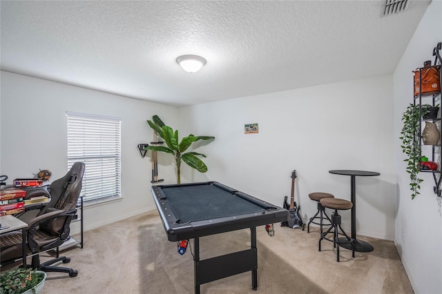 game room with a textured ceiling, pool table, carpet flooring, visible vents, and baseboards