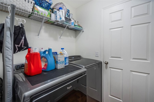 clothes washing area featuring laundry area and separate washer and dryer