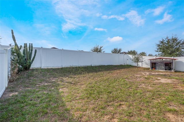 view of yard with a fenced backyard