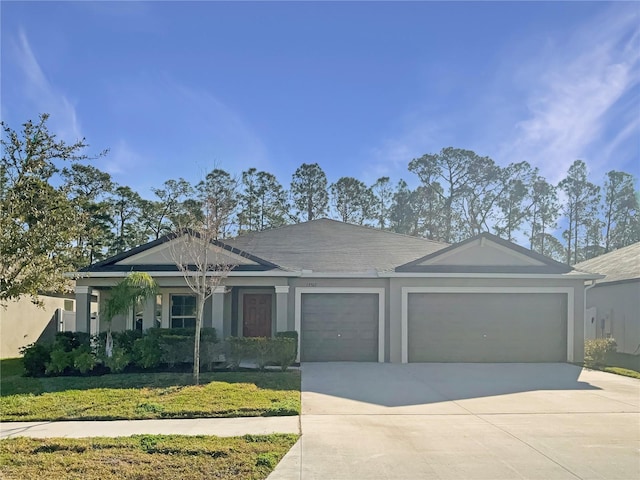 single story home with a garage and a front yard