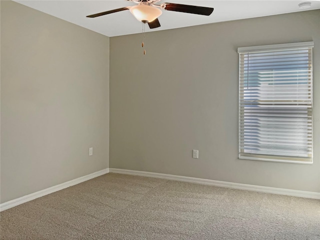 carpeted empty room featuring ceiling fan