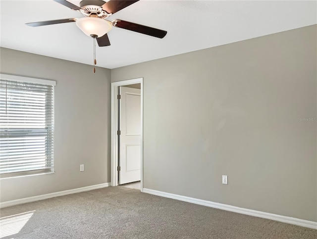 carpeted empty room with ceiling fan