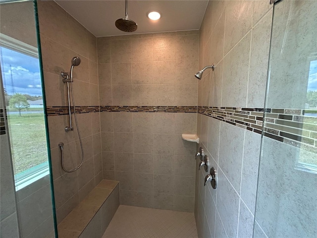 bathroom with a tile shower