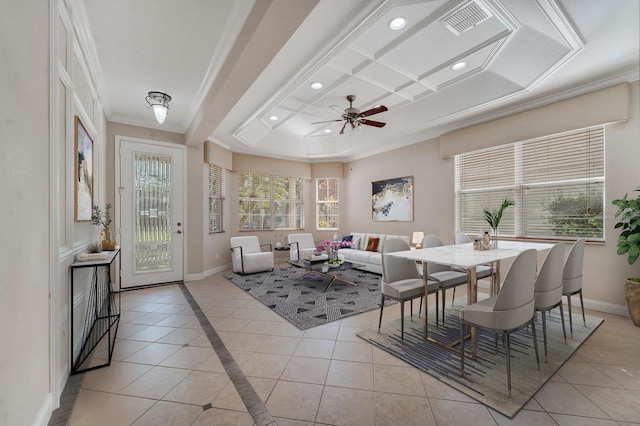 interior space with coffered ceiling, light tile patterned floors, ornamental molding, and ceiling fan