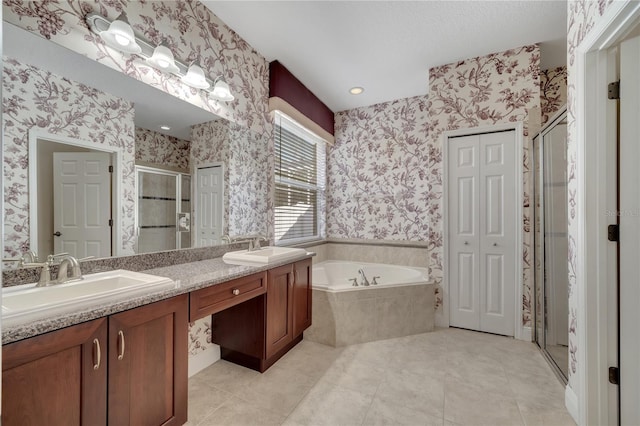 bathroom featuring tile patterned floors, vanity, and independent shower and bath