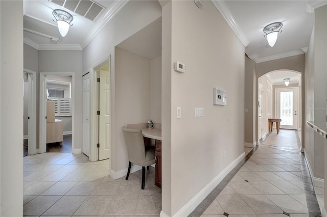 hallway with crown molding and light tile patterned flooring