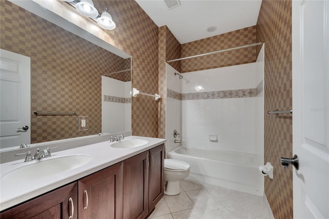 full bathroom featuring vanity, toilet, tile patterned floors, and tiled shower / bath