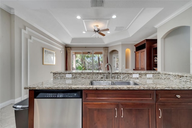 kitchen with sink, crown molding, stainless steel dishwasher, a raised ceiling, and ceiling fan