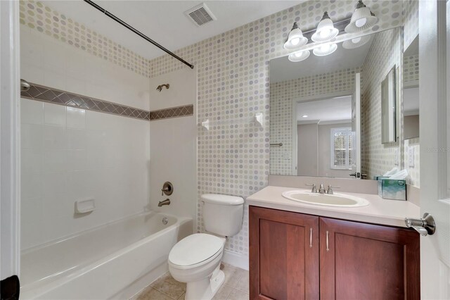 full bathroom featuring tile patterned flooring, vanity, bathtub / shower combination, and toilet