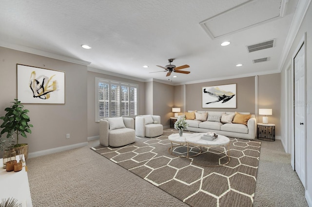 living room with ornamental molding, light colored carpet, and ceiling fan