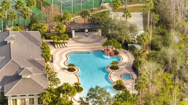 view of swimming pool with a patio and pool water feature