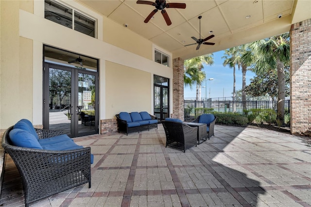 view of patio featuring outdoor lounge area, french doors, and ceiling fan