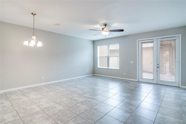 15574 Murcott Blossom Blvd, Winter Garden, FL 34787 - empty room with french doors, light tile patterned floors, a chandelier, and a ceiling fan