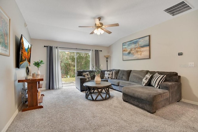 carpeted living room featuring ceiling fan and lofted ceiling