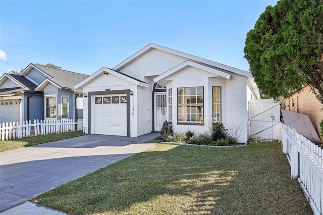 single story home featuring a garage and a front lawn