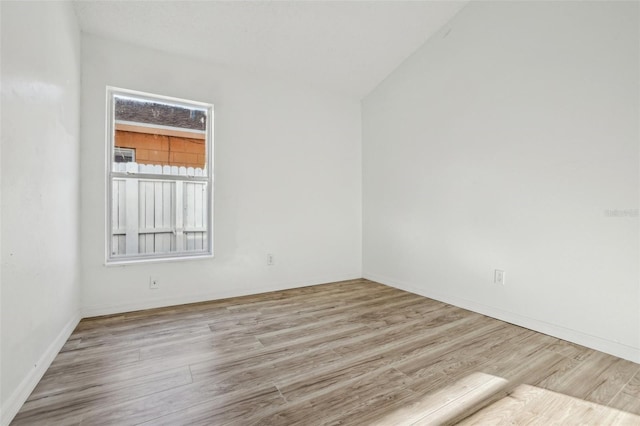 empty room with light hardwood / wood-style floors