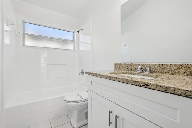 full bathroom with tile patterned flooring, vanity, tiled shower / bath, and toilet