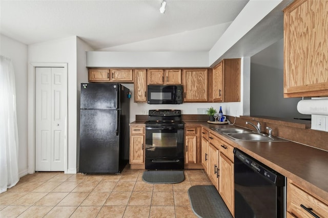 1821 Christina Lee Ln, Saint Cloud, FL 34769 - kitchen with light tile patterned floors, sink, vaulted ceiling, and black appliances