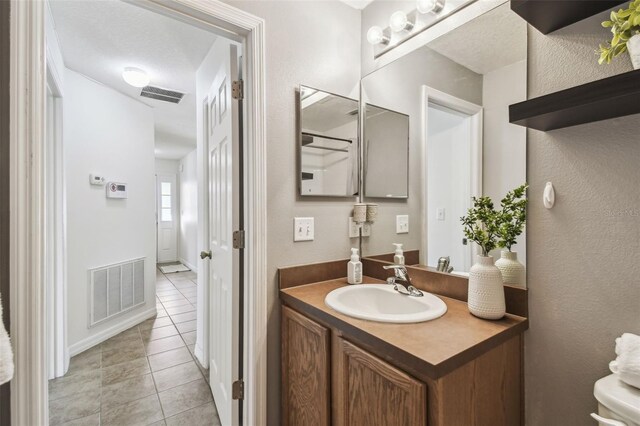 1821 Christina Lee Ln, Saint Cloud, FL 34769 - bathroom with vanity and tile patterned flooring