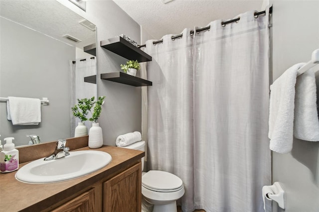 1821 Christina Lee Ln, Saint Cloud, FL 34769 - bathroom featuring toilet, vanity, and a textured ceiling
