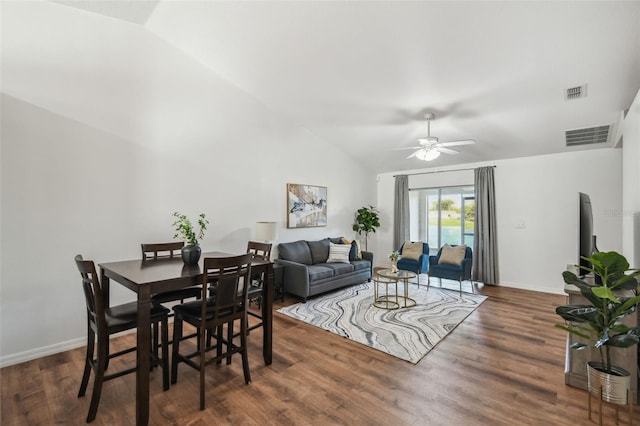 1821 Christina Lee Ln, Saint Cloud, FL 34769 - dining space with vaulted ceiling and dark hardwood / wood-style floors