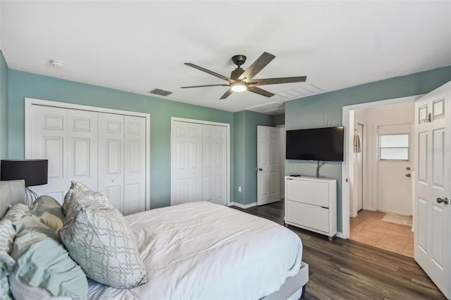 1821 Christina Lee Ln, Saint Cloud, FL 34769 - bedroom with dark hardwood / wood-style floors, two closets, and ceiling fan