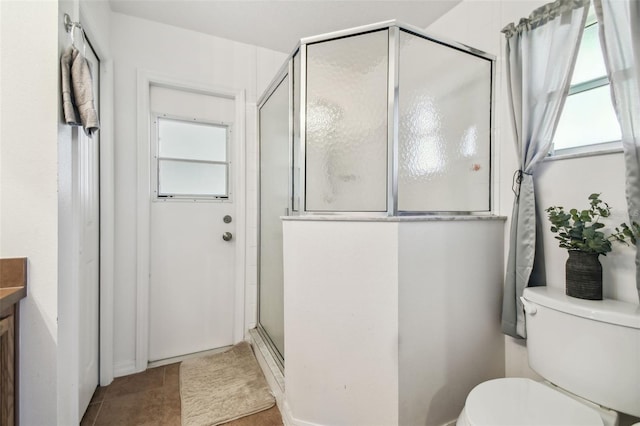 1821 Christina Lee Ln, Saint Cloud, FL 34769 - bathroom with vanity, tile patterned flooring, toilet, and a shower with door