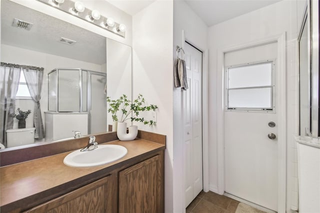 1821 Christina Lee Ln, Saint Cloud, FL 34769 - bathroom featuring vanity, tile patterned flooring, toilet, and walk in shower