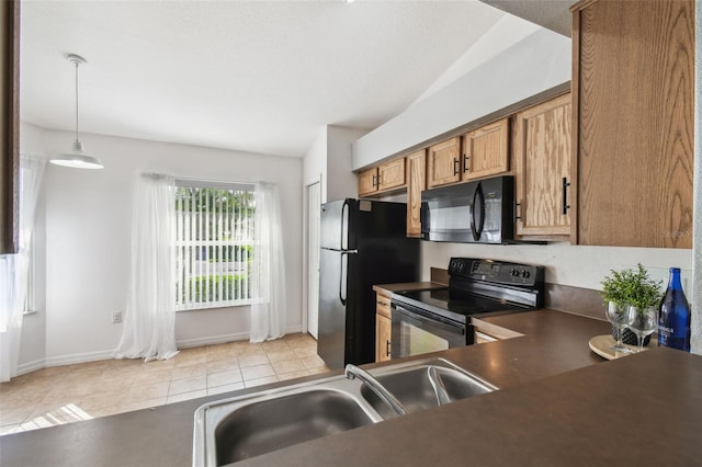 1821 Christina Lee Ln, Saint Cloud, FL 34769 - kitchen featuring hanging light fixtures, light tile patterned floors, sink, and black appliances