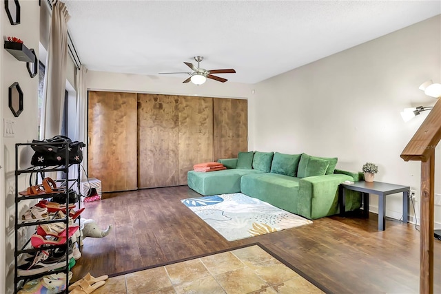 living room featuring hardwood / wood-style flooring and ceiling fan