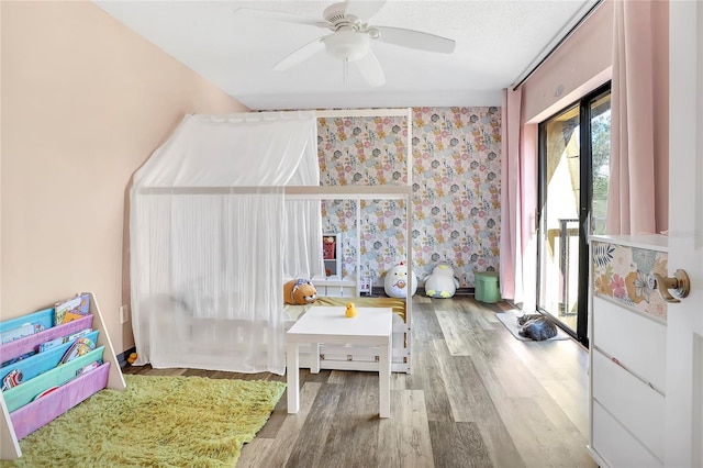 playroom featuring ceiling fan and light hardwood / wood-style floors