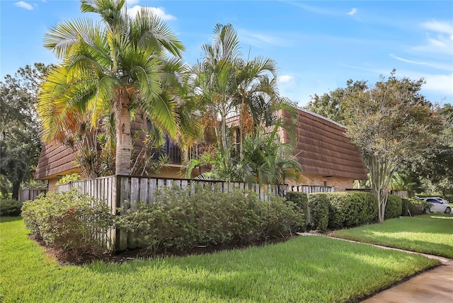 view of side of property featuring a yard