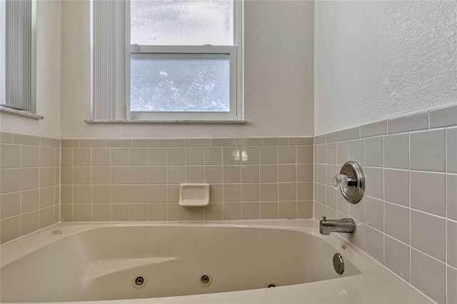 full bathroom with a whirlpool tub