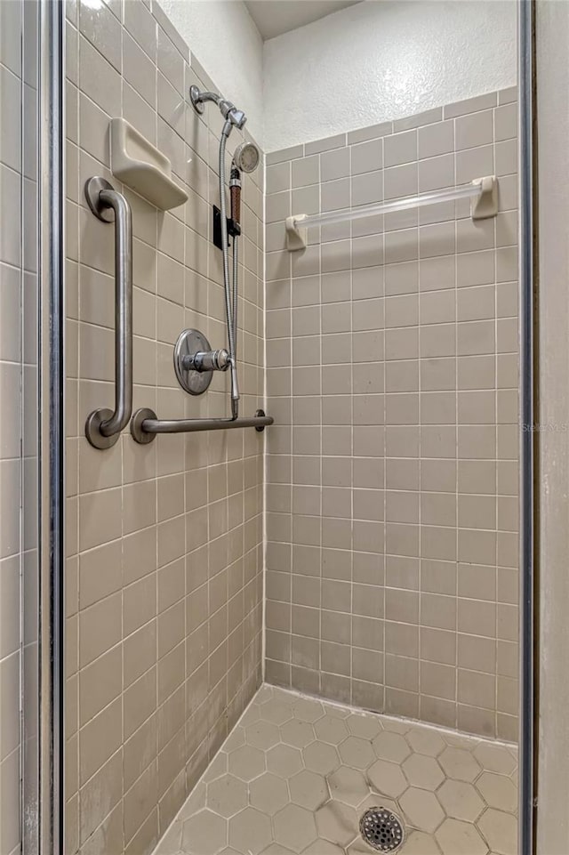 bathroom featuring a shower stall