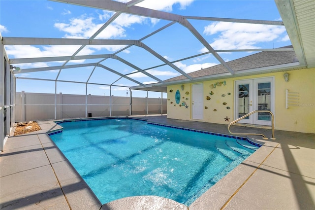 view of pool with a fenced in pool, french doors, a patio, fence, and a lanai