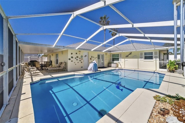 pool with a patio and a lanai