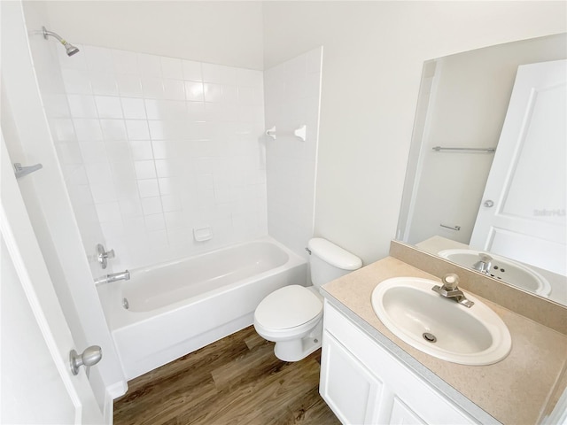 full bathroom featuring hardwood / wood-style flooring, vanity, toilet, and shower / bathing tub combination