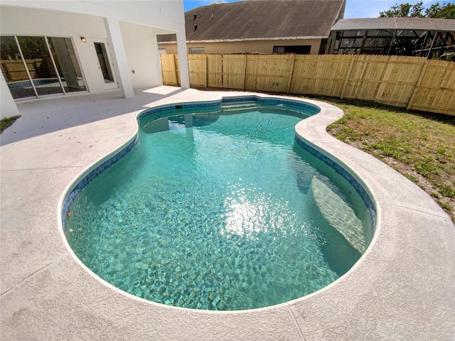 view of swimming pool featuring a patio