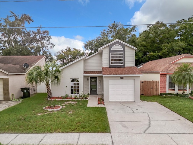 1970 Larkwood Dr, Apopka, FL 32703 - view of front facade with roof with shingles, concrete driveway, fence, and a front lawn