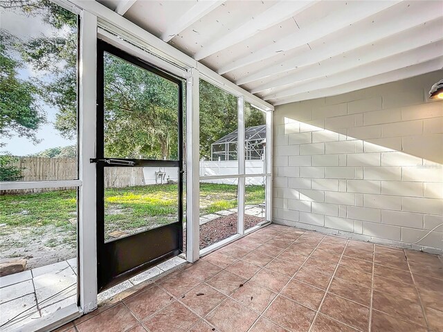 1970 Larkwood Dr, Apopka, FL 32703 - unfurnished sunroom with beamed ceiling
