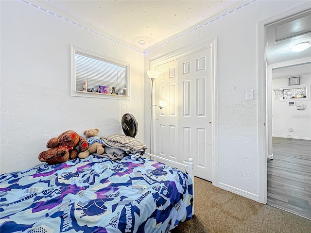 carpeted bedroom featuring a closet