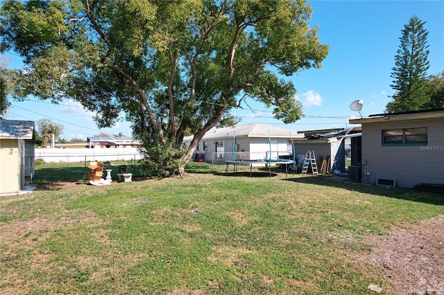 view of yard with a trampoline