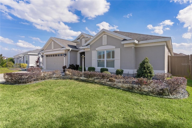 ranch-style home with a garage and a front yard