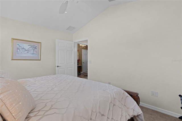 carpeted bedroom featuring ceiling fan and vaulted ceiling